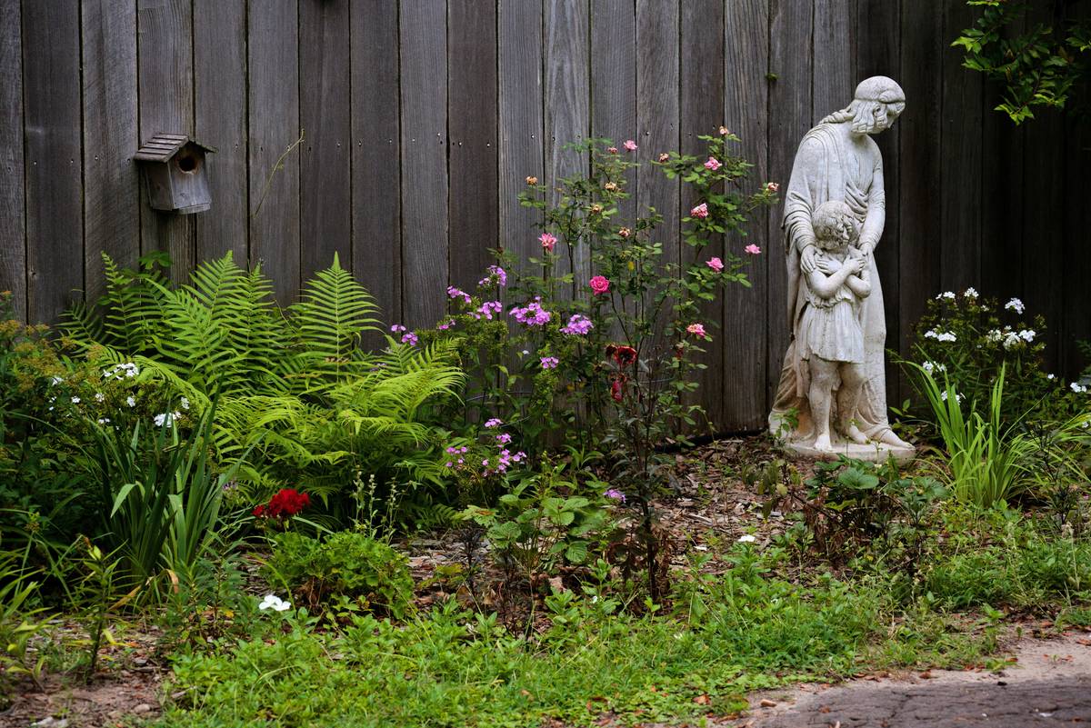 Close-up of merge gardens garden statues installed on stable gravel base with rebar anchor