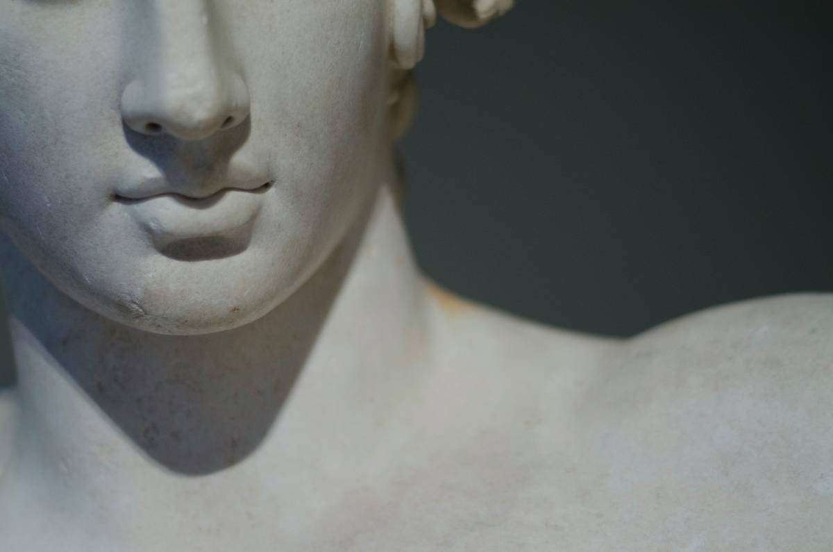 Cleaning and prepping garden statues to paint with TSP solution and brush